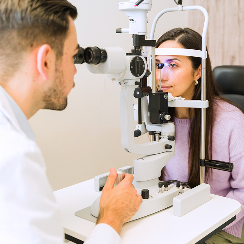 Optometrist checking eyes